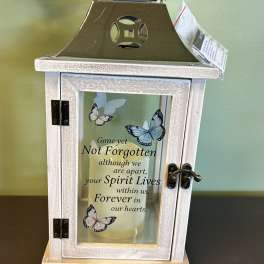 Decorative lantern with a memorial candle and butterfly design