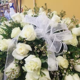 White rose bouquet with a sheer white ribbon bow