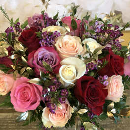 Mixed bouquet of roses in pink, red, white, and lavender