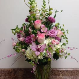 Tall mixed bouquet in a glass vase with pink and white flowers