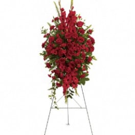 Tall standing spray of red flowers on an easel