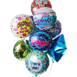 Cluster of colorful thank you mylar balloons with assorted patterns and messages.