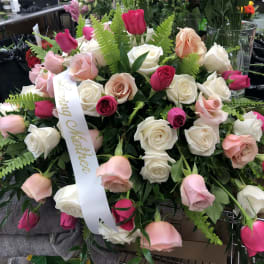 Large bouquet of pink and white roses with a ribbon