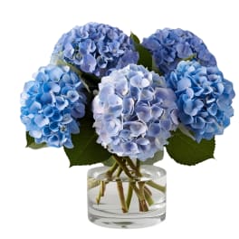 Blue hydrangea bouquet in a clear glass vase