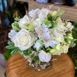 White rose and hydrangea bouquet in a glass vase