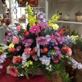 Large mixed flower basket with pink, purple, yellow, and red blooms