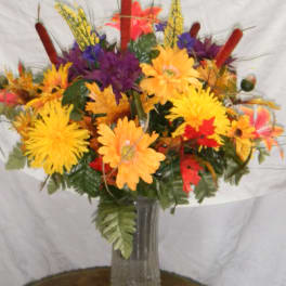 Colorful autumn bouquet in a clear glass vase