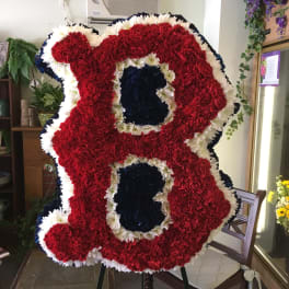 Large standing floral tribute shaped like the number 88 in red, white, and blue