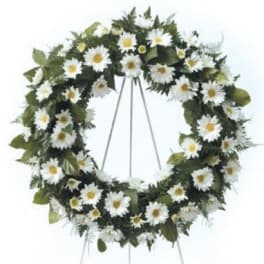 White daisy funeral wreath on a standing easel