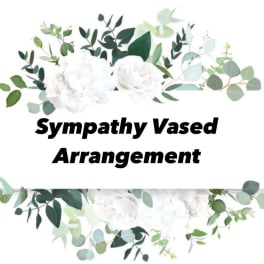 White floral sympathy arrangement with eucalyptus and greenery