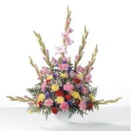 Colorful mixed flower arrangement with tall spikes and a low rounded base