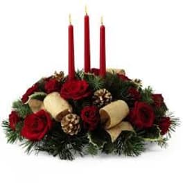 Red rose centerpiece with three red candles and pinecones