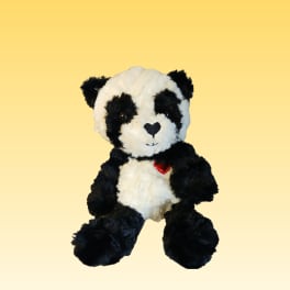 Black-and-white plush panda bear with a red heart on its chest
