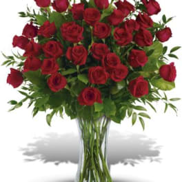 Bouquet of red roses in a clear glass vase
