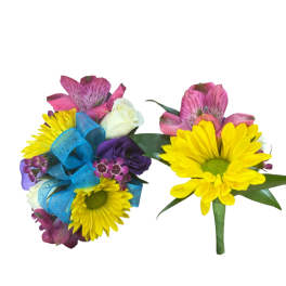 Two floral boutonnieres with yellow daisies and pink blooms