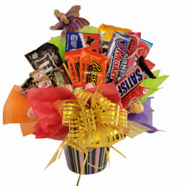 Candy bouquet in a striped container with a large gold bow