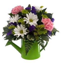 Pink carnations and white daisies in a green watering can