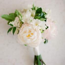 White and blush bouquet with greenery and a wrapped stem handle