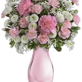 Pink and white bouquet in a pink glass vase