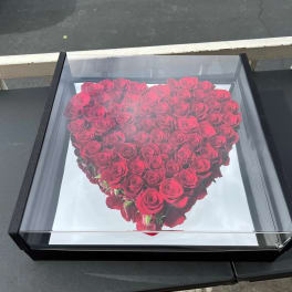 Heart-shaped box filled with red roses