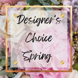 Floral sign reading Designer's Choice Spring over pink and white flowers