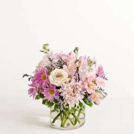 Pink and white mixed bouquet in a clear glass vase