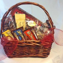 Basket of assorted chocolates wrapped in red mesh