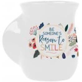 White mug with floral print and the words "Be someone's reason to smile"