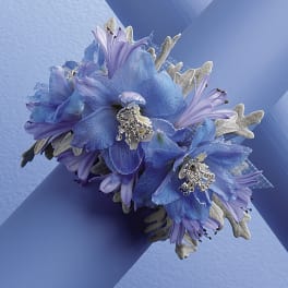 Blue and lavender floral corsage with silver accents