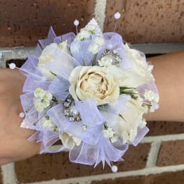Small white rose bouquet with lavender ribbon and pearl picks