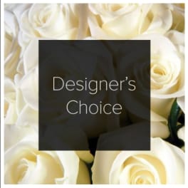 Cream-colored roses with a "Designer’s Choice" label