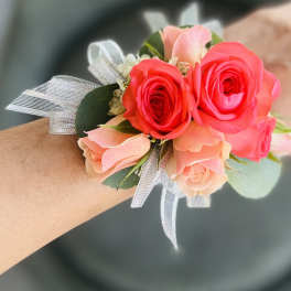 Pink and coral rose wrist corsage with silver ribbon