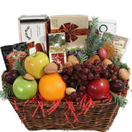 Gift basket with fruit, nuts, and assorted packaged snacks