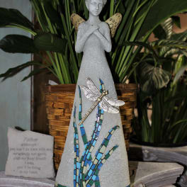 Decorative angel figurine with a dragonfly and mosaic accents