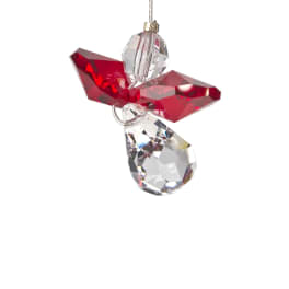 Red and clear crystal angel ornament hanging on a white background