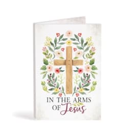 Greeting card with a wooden cross and floral wreath design