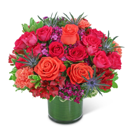Bouquet of pink and orange roses in a glass vase