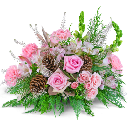Pink roses and carnations arranged with pinecones and greenery