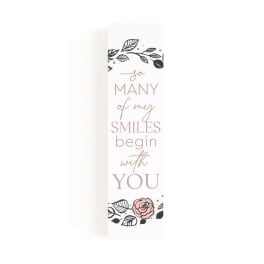 Tall white gift bag with pink floral quote text and rose illustration