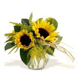 Sunflower arrangement in a clear glass vase