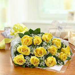 Bouquet of yellow roses wrapped in clear paper