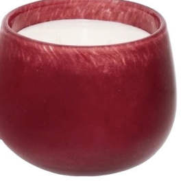 Red glass candle holder with a white candle inside