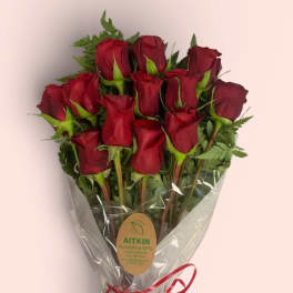 Bouquet of red roses wrapped in clear plastic