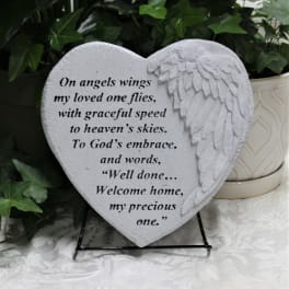 Heart-shaped memorial plaque with angel wings and a sympathy verse