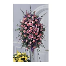 Standing spray of pink and purple flowers on an easel