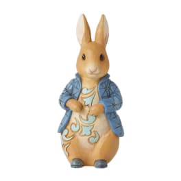 Decorative rabbit figurine wearing a blue jacket