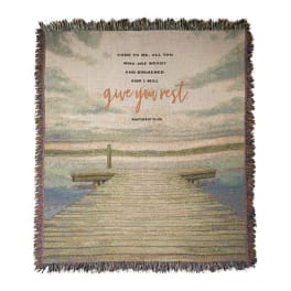 Woven throw blanket with a dock scene and Bible verse text