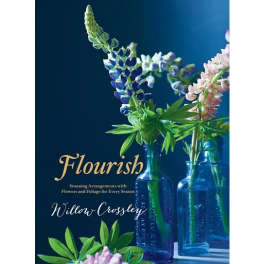 Book cover with lupine flowers in blue glass bottles