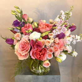 Mixed pink and purple bouquet in a glass vase