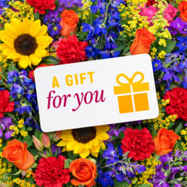 Colorful flower arrangement with a gift card reading "A GIFT for you"